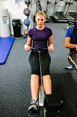 woman using rowing machine